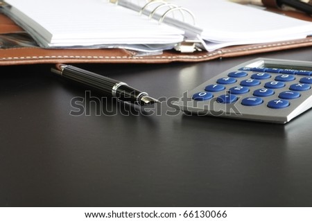 stress at work in the office concept with calculator and paperwork