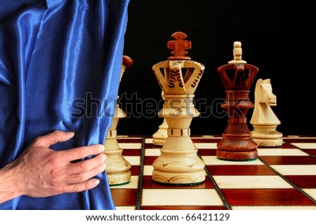 chess and curtain showing strategic business behavior