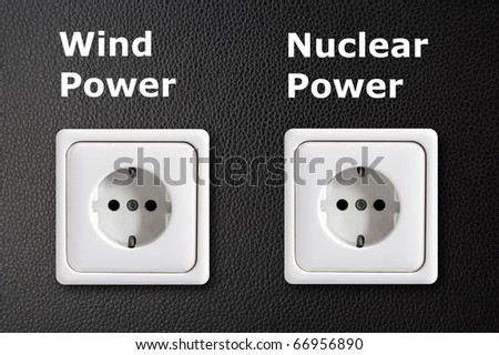 alternative energy concept with power outlet on black background