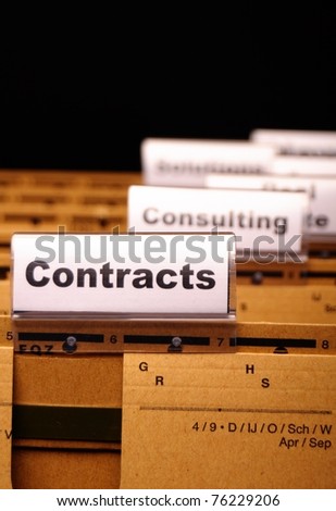 contract word on business folder showing trade or financial concept