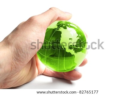 ecology concept with hand and glass globe isolated on white background