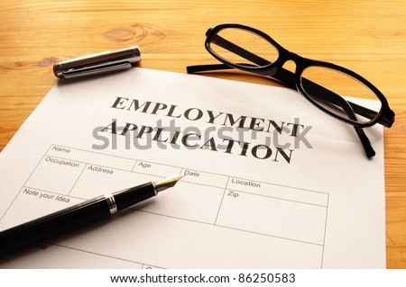 employment application form on desk showing job search concept