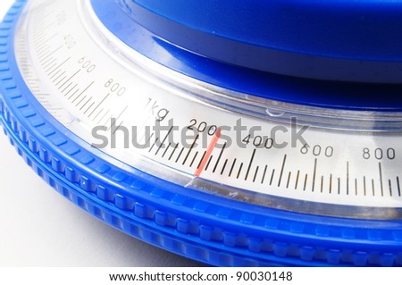 blue kitchen scales or balance showing cooking concept