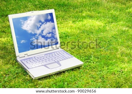 laptop and blue sky showing nature concept with copyspace