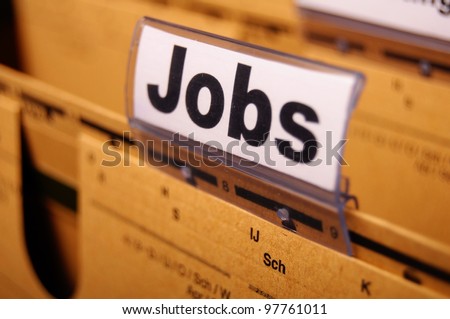 jobs or job concept with business folder in office showing earnings concept