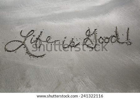 Life is good, a message written in the sand at the beach.