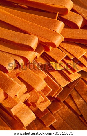 Closeup of dry sweet potato pasta noodles.
