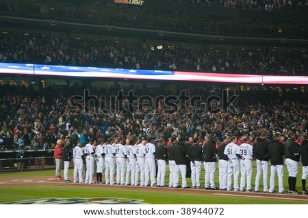 DENVER, COLORADO - OCTOBER 11:   The Colorado Rockies listen to the National Anthem prior to game 3 of the National League Division Series on October 11, 2009 in Denver Colorado.