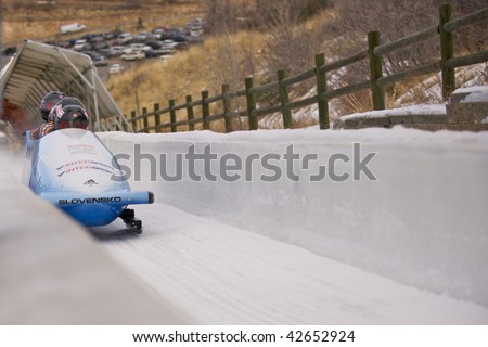 PARK CITY - DECEMBER 5: The Slovakia Four-Man Bobsled team crosses the finish line at the America\'s Cup Bobsled Races in Park City  December 5, 2009 in Park City, Utah.