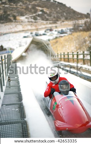 PARK CITY - DECEMBER 5: The Jamaican Four-Man Bobsled team crosses the finish line at the America\'s Cup Bobsled Races in Park City  December 5, 2009 in Park City, Utah.