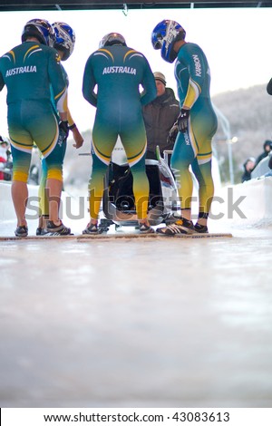 PARK CITY, UTAH - DECEMBER 5: The Australian bobsled team prepares their sled for the start of the race  at the America\'s Cup Bobsled Races December 5, 2009 in Park City, Utah.