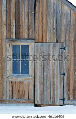 Closeup of a barn door and window at the Tate Barn at Solider Hollow.