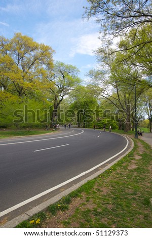Joggers and cyclists enjoy a spring day in Central Park in New York.