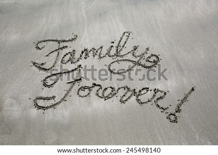 Message written in the sand, family forever