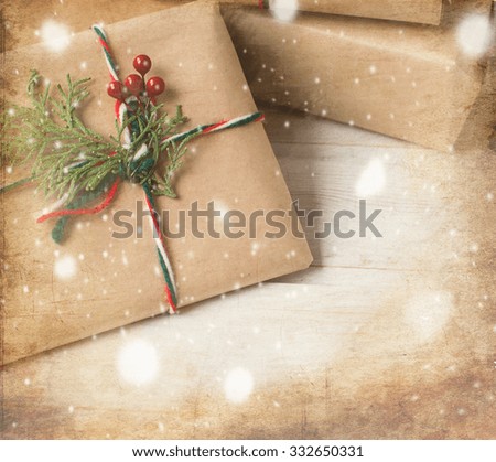 step by step photo decoration New Year gift ribbons, branches and berries, fir branch, colorful ribbons, cones and nuts on an old wooden board, rozhdestveskaya card, toned image, selective focus