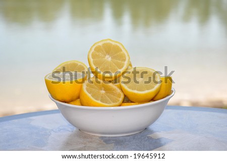 a bowl of lemons cut in half