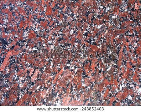 Classic texture of granite. Mineral composition of rocks are quartz, plagioclase, potassium feldspar and biotite mica. Red tone