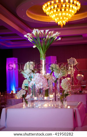 Elegant floral set up for an event with candles lit