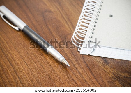 Pen and coiled notebook
