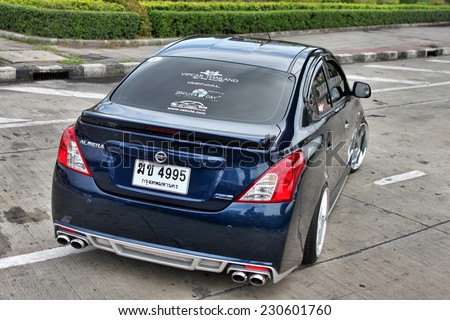 BANGKOK, THAILAND - JULY 7, 2014 : NISSAN ALMERA, an ECO Car SEDAN in Thailand, is being posted in one of Thailand magazine to promote that ECO Car can be modified into VIP Style.