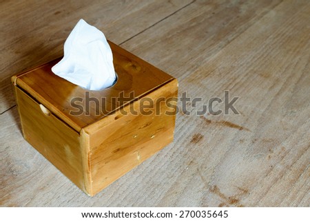Wooden tissue box on the wood table