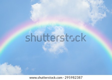 Nature heart cloudscape with blue sky and white cloud with rainbow