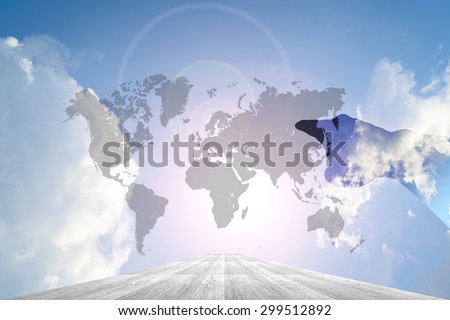 Hand on Wood way and Blue sky background with world map
