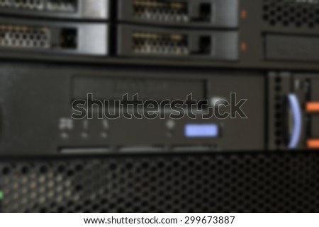 Blurred Computer Server and tape drive in datacenter