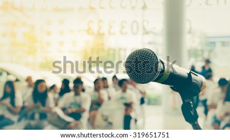 Microphone in seminar event defocus on person background , process in vintage style