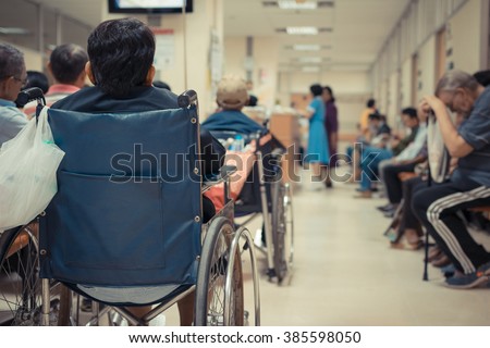 Patient elderly on wheelchair and many patient waiting a doctor and nurse in hospital , process in vintage style