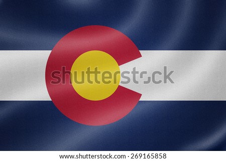 Colorado flag on the fabric texture background