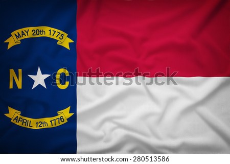 North Carolina flag on the fabric texture background,Vintage style