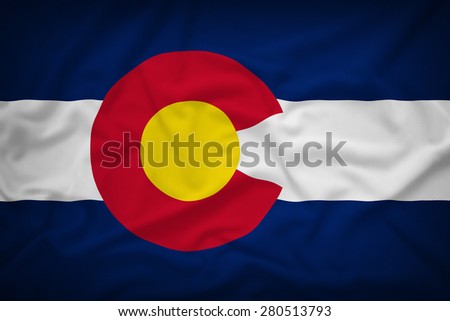 Colorado flag on the fabric texture background,Vintage style