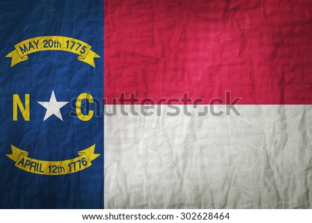 North Carolina flag painted on a Fabric creases,retro vintage style