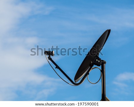 Black Satellite dish in the blue sky. use for  receiver wave from satellite.