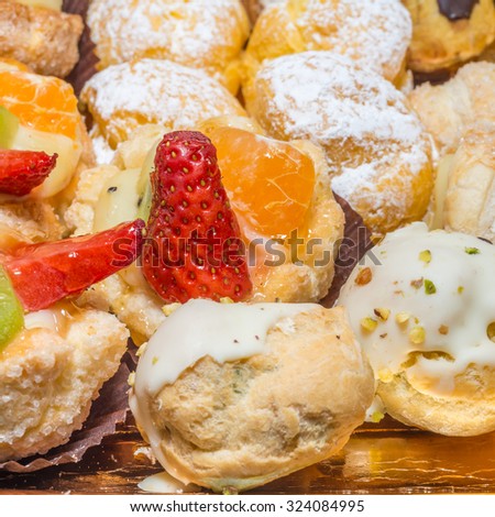 colorful pastries with fruits, cream and chocolate, the real Italian confectionery