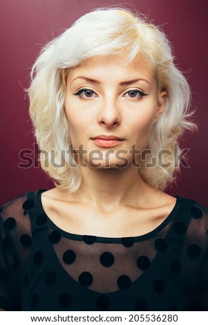 Simple portrait of young blonde woman