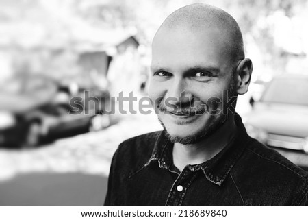 Handsome man with a beard outdoors portrait. Black and white portrait.
