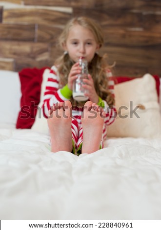 Portrait Of Happy Girl In Holiday Pajamas, Focus on Feet