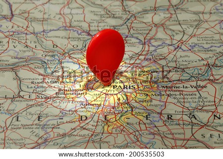 Map of Paris/Red map pointer stuck into map of Paris