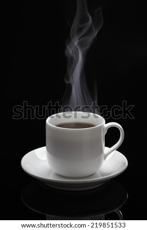Cup of black coffee/Cup of black coffee with steam on the black background