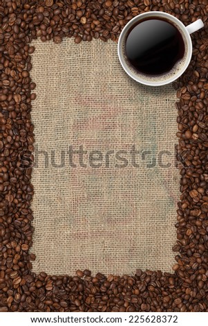 Coffee frame/Coffee beans and Coffee cup on a jute background