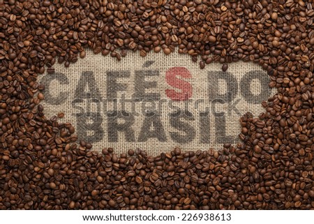 CAFES DO BRASIL/Coffee beans on jute background