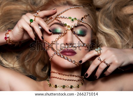 Art portrait of woman with glamour make up and fashion jewelry.