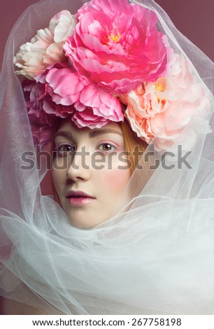 beauty portrait of woman with natural make up and flowers over face.