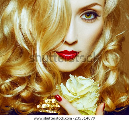 Beautiful Sexy Woman face closeup, makeup with Red Lips and Nails. Beauty blond Girl. Passion. Makeup, Hairdo and Manicure. Sensual Mouth. Sexy Red Color Lips. Gold bakground