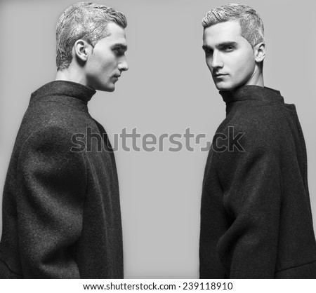 Snow Adonis fashion beauty concept. Dual emotive portrait of young man with stylish snow-white haircut posing over grey background. Perfect hair & skin. Vogue avant garde style. Close up. Studio shot