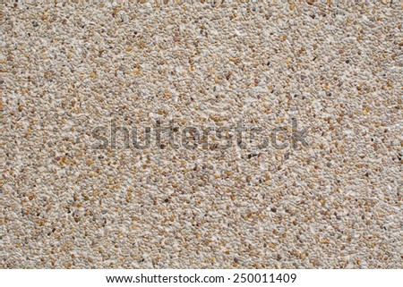 rough texture surface of exposed aggregate finish, Ground stone washed floor, made of small sand stone in light brown color