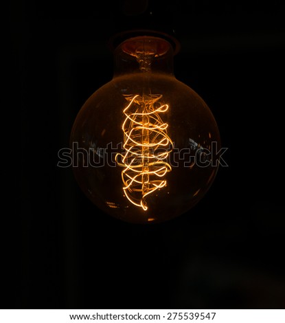 glowing light bulb in the dark