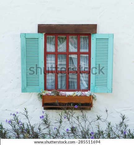 vintage window on white wall - soft focus with vintage filter